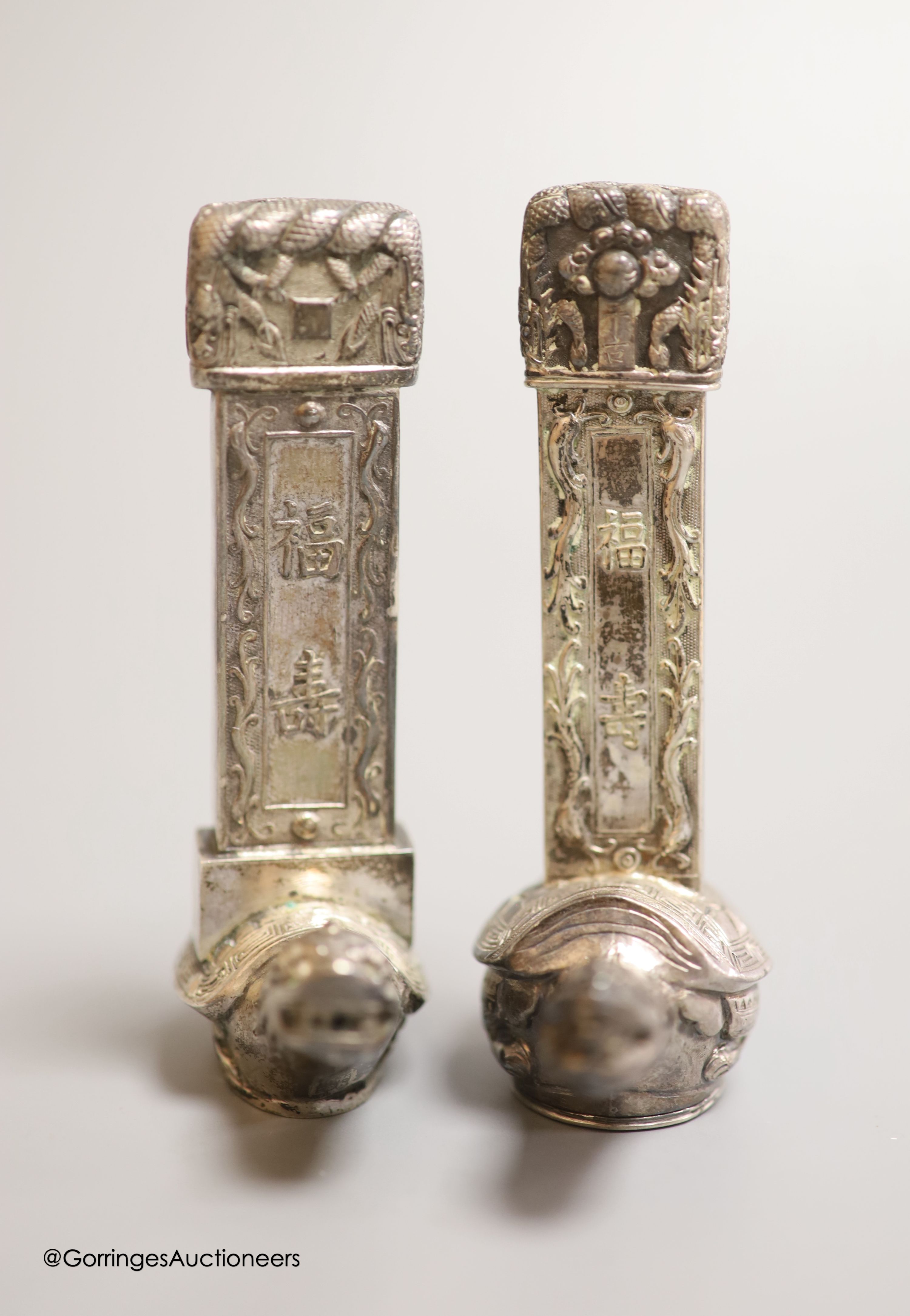 Two Chinese white metal salt and pepper shakers, 9cm and a Canton enamel cup.